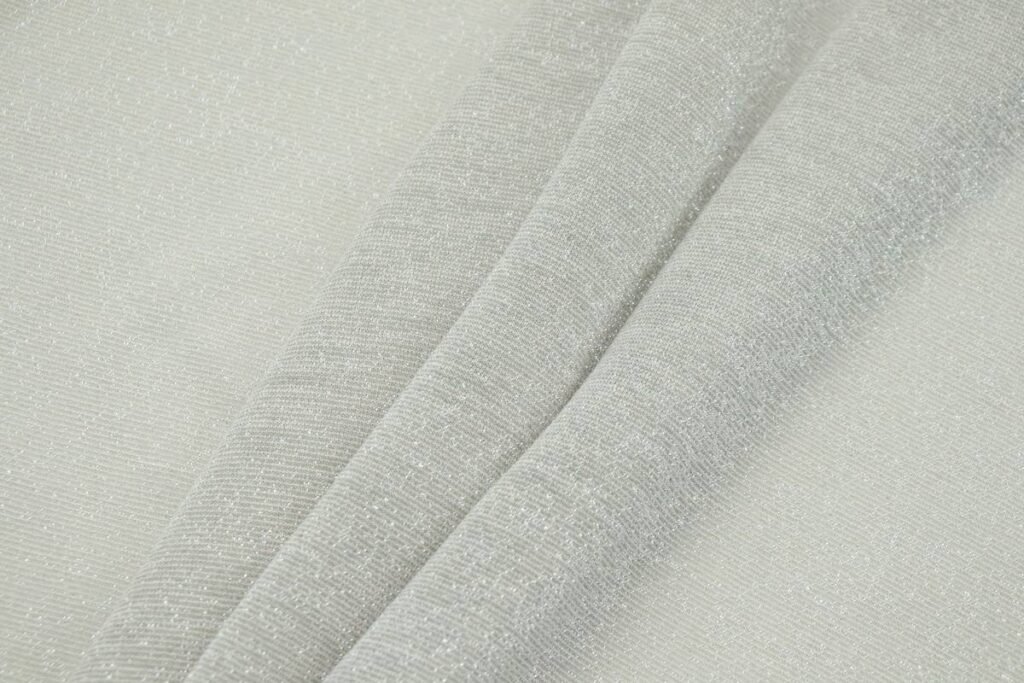 a close up view of a white fabric