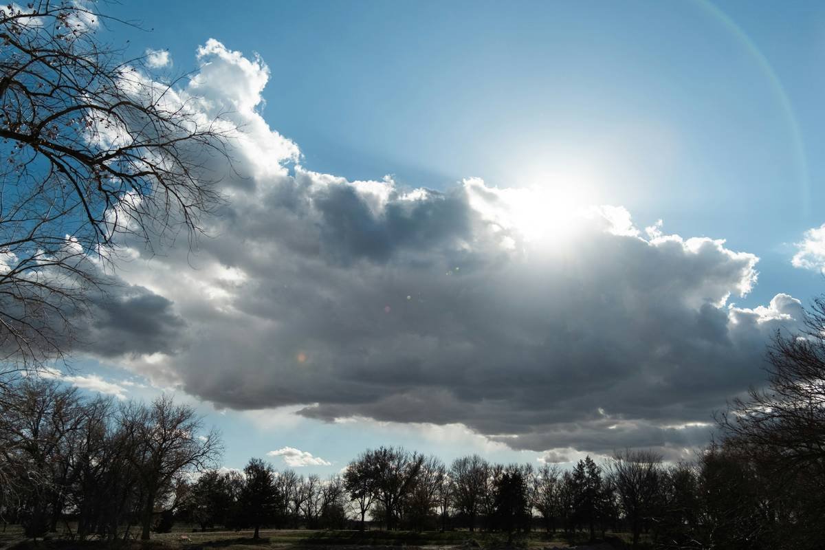 the sun is shining through the clouds in the sky