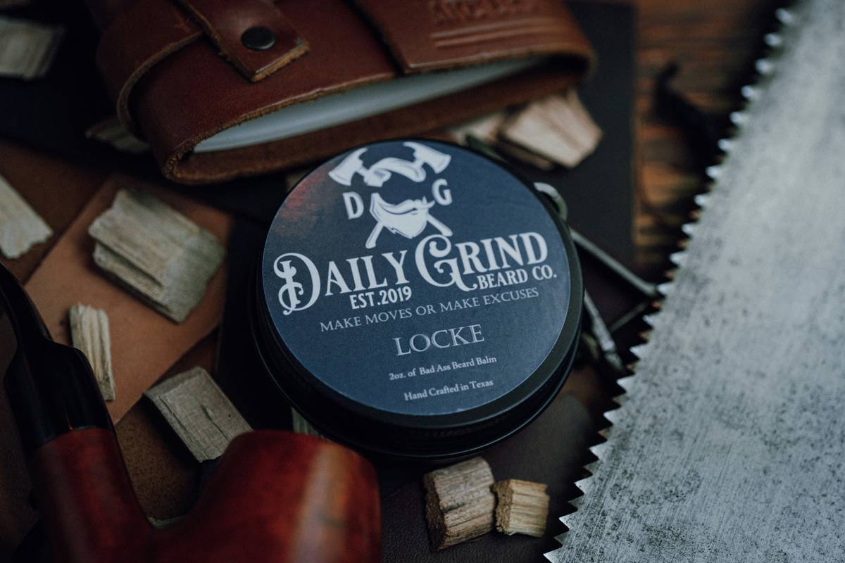 Product photo of Locke Beard Balm by Daily Grind Beard Co. Product Photography by branding photographer Lance Reis in Portland Oregon. Elements of Cedar & Leather were added to visually showcase the scents you can expect from Locke. I added a saw for a more gritty vibe. Did you discover us here? Say hi on insta: Kickassdesigns & daily_grind_beard_co
